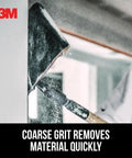 Worker using Pro-Pak Drywall Sanding Paper, 120 Grit to sand wall, highlighting coarse grit efficiency.