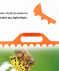 Orange 9 Frame Beehive Spacer For Easy Frame Spacing, lightweight plastic, durable, detailed view with bee and flower background