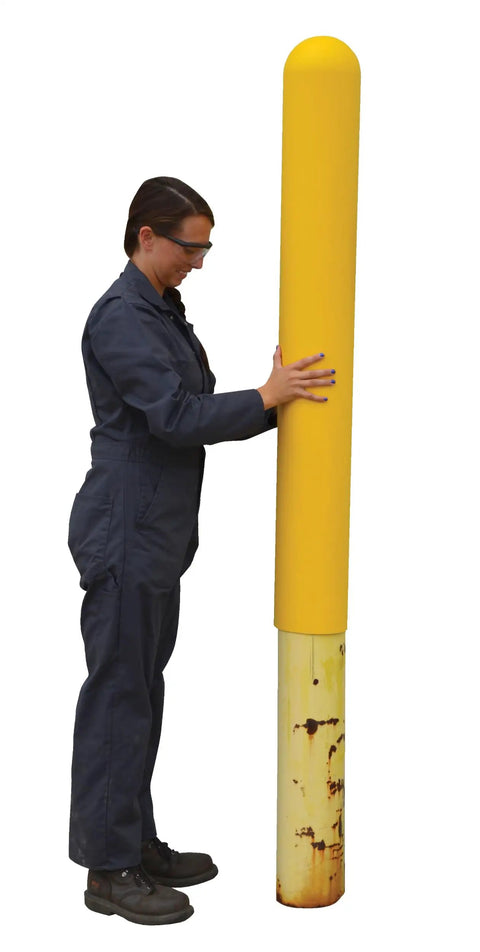 Person demonstrating the Straight Up Heavy Duty Yellow Bollard Post Cover 48 Inch Height By 6.5 Diameter Low Density Polyethylene Thermoplastic Guard.