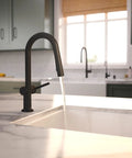 hansgrohe Talis N Pull Down Kitchen Faucet, Modern, Magnetic Hand Sprayer, 1-Handle, 1.75 GPM, Matte Black, 72866671, water flowing into sink.