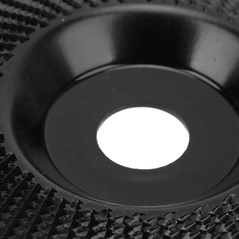 Close-up of Heavy Duty Tungsten Carbide Grinding Wheel 125mm Angle Grinder Disc with sharp teeth for sanding and polishing.