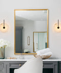 ELYCCUPA 10” Marble Wall Sconces Set of Two Matte Black Classic Stone Alabaster Wall Lights on vanity with mirror.