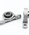 Badass 4 Pc Set Of KP004 Pillow Block Bearings With 20mm Bore Housing Solid Zinc Alloy And Steel Insert Self Aligning Design For Shafts That Provide Heavy Duty Durability To Run Your Machines Smoothly Every Day Without Zero Hiccups Or Glitches Now. 20mm zinc alloy pillow block bearing with steel insert, side and top views