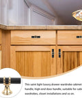 10 Piece Black Zinc Alloy Cabinet Handles And Drawer Pulls For Wardrobe Dresser And Furniture Replacement Hardware shown on wooden cabinets