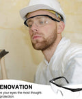 Worker wearing Anti Fog Safety Glasses with Clear Wraparound Lenses Scratch Resistant Eye Protection, using a hammer.