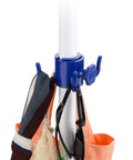 Close-up of blue hook holding towels and sunglasses on a pole. Part of Beach Umbrella Sand Anchor Heavy Duty Outdoor Stand Base system.