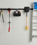 FastTrack Garage Storage Rail System 7 Piece Hook Kit with tools and ladder in home garage