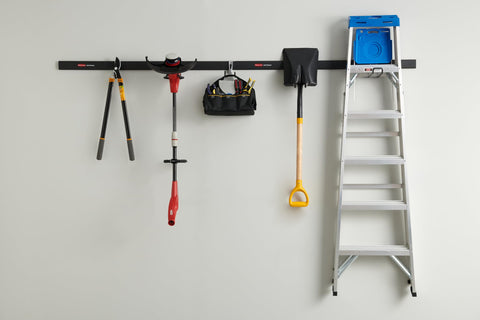 FastTrack Garage Storage Rail System 7 Piece Hook Kit with tools and ladder in home garage