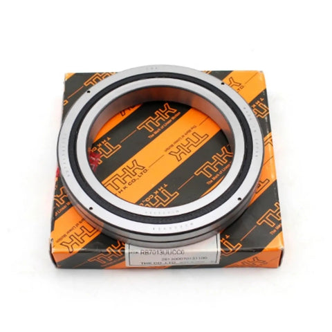 One Piece Heavy Duty Cross Roller Slewing Bearing RB6013 RB6013UUCC0 RB6013UUC0 featuring precision rings on THK packaging.
