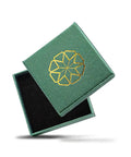 Green jewelry box with gold geometric design, open lid revealing black interior, for Dope 14K Yellow Gold I Love You ASL Hand Sign Pendant Necklace With Rolo Chain, Small Charm That Says I Love You In American Sign Language, Comes In 16, 18, 20, Or 22 Inch Length Options.