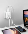 2 Pack US To UK Ireland Travel Plug Adapter Type G with devices connected, showing 2 outlets, 3 USB ports, and 1 USB-C in use