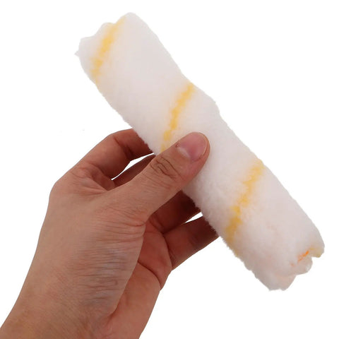 No Sweat Replacement Paint Roller Sleeve Covers For Silky Smooth Interior Wall Coatings And Textured Surfaces With Nearly Zero Lint Drop For Chill DIY Projects And Studio Quality Results Two Pack held in a hand.