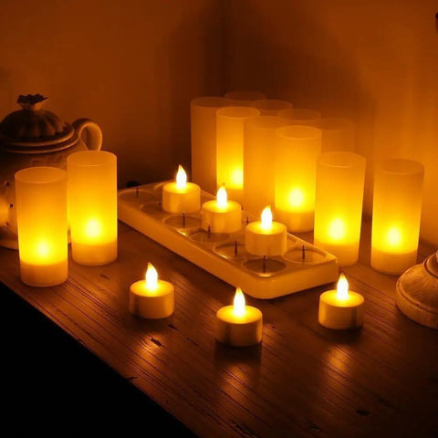 Rechargeable Tealights Flickering Flameless Candles With Charging Base And AC Adapter 12 Pack LED Tealight Set glowing on table