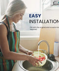 Woman rinsing cherry tomatoes in a bowl, showcasing easy installation of the Straight Up Clean Commercial Water Filter.