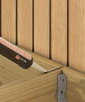 Applying adhesive to wood joist in deck construction with EB-TY Premium Hidden Deck Fastening System With Two And One Quarter Inch Type 305 Stainless Screws