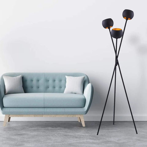 Tripod Floor Lamp In Matte Black With Three Globe Heads And Intertwining Legs Dope Modern Mid Century Style next to sofa in living room