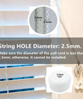 White Plastic Cord Tassel Knob Drops Pack Of 20 For Window Blinds And Roman Shades Easy DIY End Caps For Curtain Drawstrings Tassels Snow White Color One Inch By Five Eighths Inch Fits Two Point Five Millimeter DIY Curtain Craft Projects. Close-up of white plastic cord tassel knobs with 2.5mm hole for blinds and shades