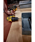 Compact 20V Cordless Drill And Driver Kit with Brushless Motor used to attach electrical box on wood, showcasing lightweight design.