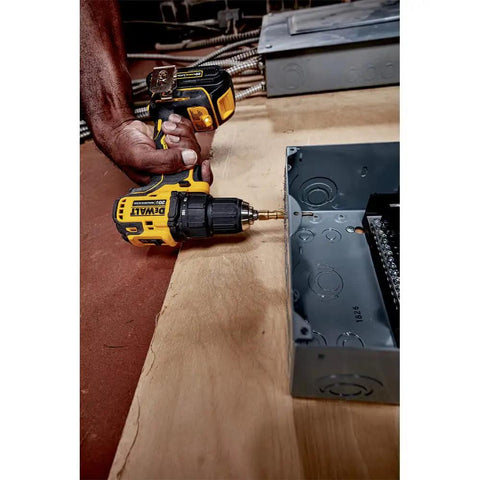 Compact 20V Cordless Drill And Driver Kit with Brushless Motor used to attach electrical box on wood, showcasing lightweight design.