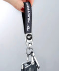 Top Shelf Genuine Leather Car Keychain With Mirror Polish Zinc Alloy Hook Fresh Daily Grind Accessory For Ford Mustang Owners sleek black keyring in hand