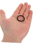 Person holding black NBR seal ring from 1200 Pcs NBR O Ring Assortment Kit Rubber Seal Rings For Plumbing And Auto Repair Leak Stop Gaskets
