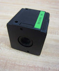 Hydraulic filter housing (glass bowl missing) Part 0821303500 showing a black cube design on a wooden surface