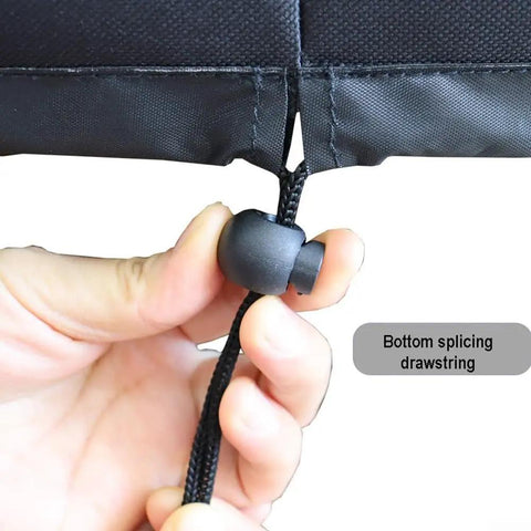 Hand adjusting elastic hem cord on waterproof Oxford cloth spreader cover for mini broadcast spreader 25.9 by 25.9 inches.