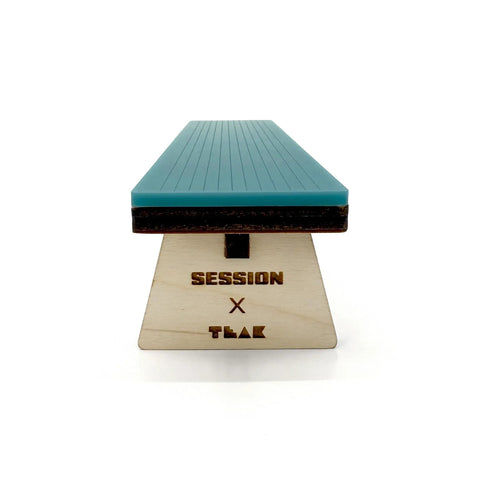 Front view of Wooden Fingerboard Bench Obstacle with Baltic Birch Wood and Teal Acrylic Surface for Smooth Fast Slides.