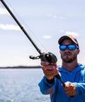 Angler using Torrent Baitcaster Rod Two Piece Portable Casting Rod For Sensitive Lightweight High Strength IM6 Carbon Build