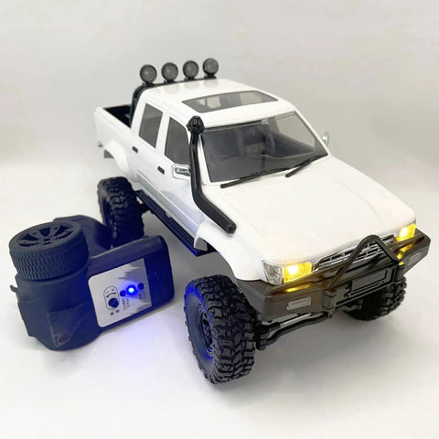 4x4 RC Rock Crawler Truck With Beefed Up Chassis And Twin Cab Hard Body, remote controller, front side view