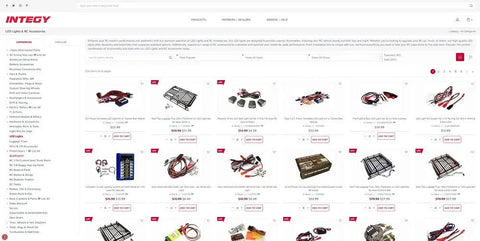 Online store page showing various RC car parts including Beef Up Your DR10 Drag Race Car RTR With Billet Machined Alloy Steering Knuckles.