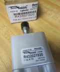Close-up of Rexroth Bosch TM-811000-03130 Pneumatic Cylinder on wooden surface, showing label and 1/4 inch ports.