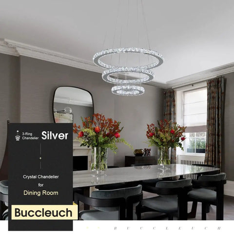 Modern LED crystal chandelier with ring lamp body dimmable 6500K cool white hanging over dining table in elegant room.