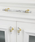 White Marble And Gold Drawer Pulls Set, 10 Pack, 3 Inch Center Hole T Bar Zinc Alloy Cabinet Handles installed on white cabinet
