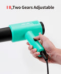 Mint Green Heat Blower Gun With Foldable Handle For Sublimation Blanks And Shrink Wrap Film, 110V 1300W Hot Air Gun in hand