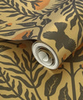 Close-up of rolled Premium Bluebird Damask Gold Metallic Wallpaper Eco Friendly Fibrous Texture with floral design.