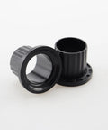 Heavy Duty Replacement Flanged Caster Yoke Spindle Bushing M167267 showing two black spindle bushings for John Deere Z Series tractors.