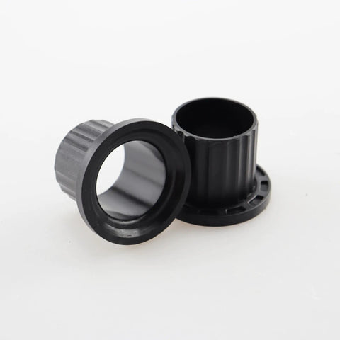 Heavy Duty Replacement Flanged Caster Yoke Spindle Bushing M167267 showing two black spindle bushings for John Deere Z Series tractors.