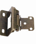 Close-up of self closing cabinet hinge set half inch steel semi wrap overlay, bronze finish, rust resistant, ideal for compact spaces.