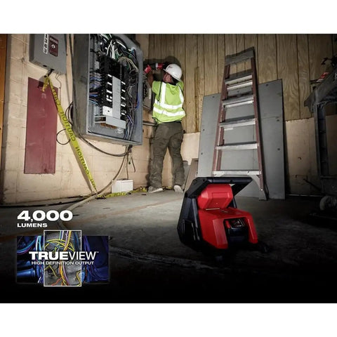 Beast Dual Power 4000 Lumen LED Flood Light With Corded And Cordless Operation at an indoor jobsite, illuminating maintenance work.