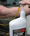 Lubrimatic Fluid Quart Pump fits standard quart bottles for easy handheld oil transfer shown in use