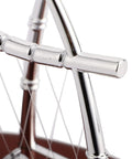 Close-up of polished frame of Newton's Cradle Desk Toy For Home Office Stress Relief With Metal Balance Balls Pendulum Demonstrating Momentum And Energy