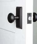 Vale Short Plate With Keep Knob In Black Iron Dope Door Hardware For Sleek Entryway Look on white door