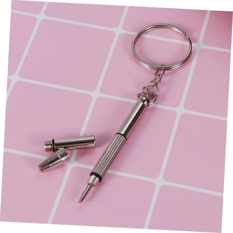 Eyeglass Repair Kit With Assorted Tiny Screws Nose Pads And Screwdriver For Sunglasses And Spectacles Complete Tool For Quick Repairs And Adjustments Grab And Go Convenience With Organized Storage Case, featuring screwdriver keychain on pink background.