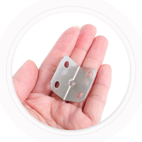Hand holding a Built Tough Heavy Duty 100-Piece L Bracket, cold rolled steel angle brace for furniture and tables.