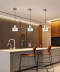 Straight Up Stylish Nordic Modern Marble And Stainless Steel Pendant Ceiling Light With E27 Bulb Socket in contemporary kitchen setting.