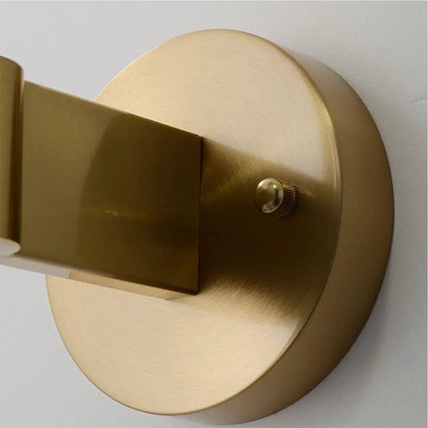 Mid Century Modern Indoor 3 Light Globe Wall Sconce With Smoke Gray Glass Shade And Brushed Brass Finish base detail
