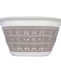 Collapsible Laundry Basket With Handles, Small Taupe White Pop Open Waterproof Plastic Bin, side view with floral pattern.