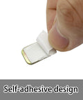 Hand holding self-adhesive weight from Easy Peasy Ceiling Fan Blade Balancing Kit Three Pack With Plastic Clips And Nine Metal Self Adhesive Weights Fix Unbalanced Fans Fast Includes 3 Clips And 9 Three Gram Weights Simple DIY Fan Repair Kit