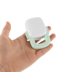 Hand holding Sturdy 4 Pack Oven Door Lock For Cabinets And Appliances, Kid Safe Kitchen Safety Locks, Easy Install, Light Green